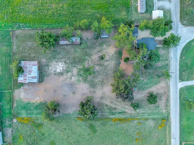 an aerial view of residential house with outdoor space