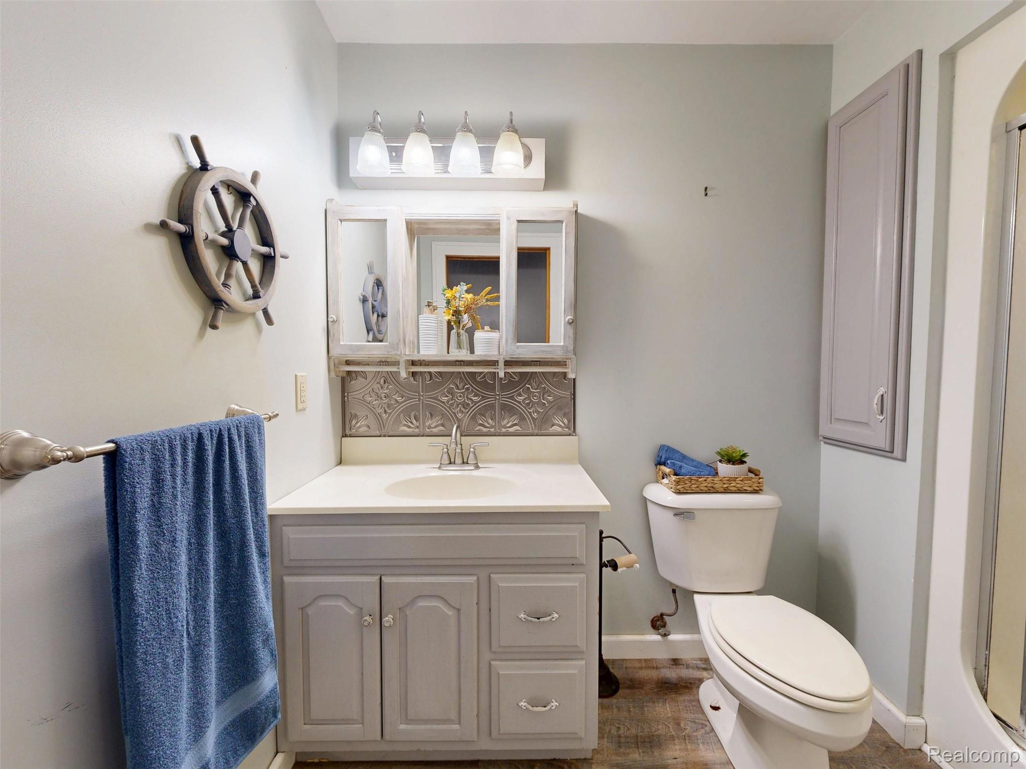 12930 Wilkinson Road Freeland, MI 48623 - Photo 60 of 76 Vanity with an integrated sink and base cabinetry