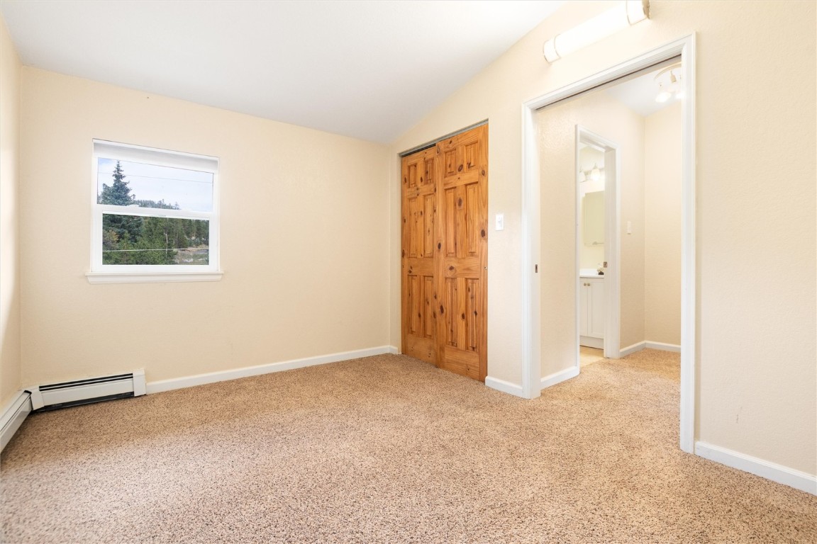 163 High Tor Road, Unit 2 Breckenridge, CO 80424 - Photo 19 of 48 an empty room with windows and closet