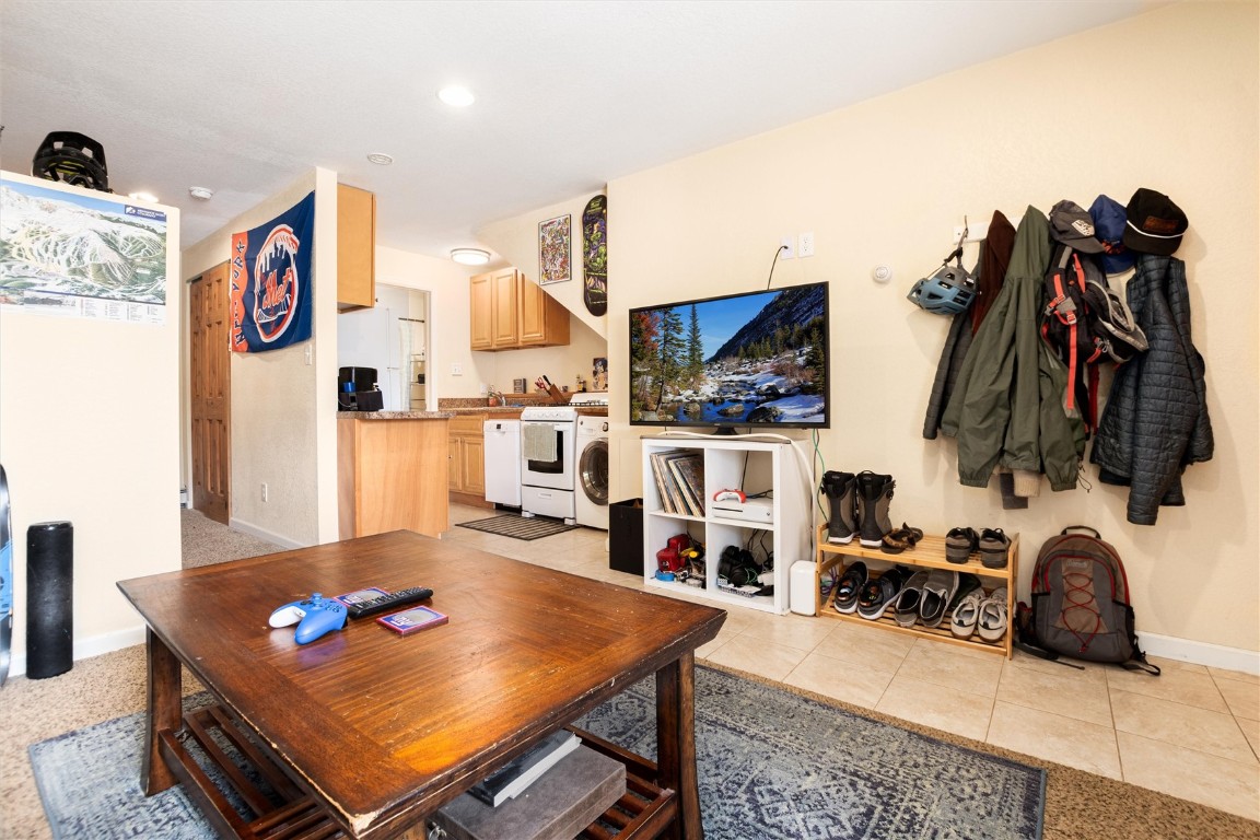 163 High Tor Road, Unit 2 Breckenridge, CO 80424 - Photo 22 of 48 a living room with furniture and a flat screen tv