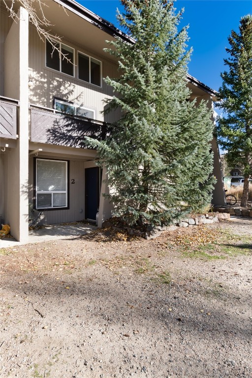 163 High Tor Road, Unit 2 Breckenridge, CO 80424 - Photo 42 of 48 a view of a house with a yard and garage
