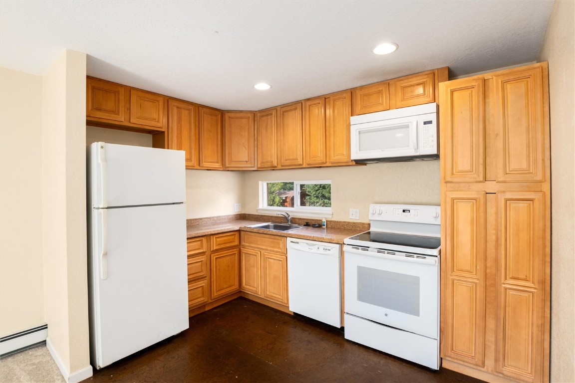 163 High Tor Road, Unit 2 Breckenridge, CO 80424 - Photo 10 of 48 a kitchen with a refrigerator sink stove and cabinets