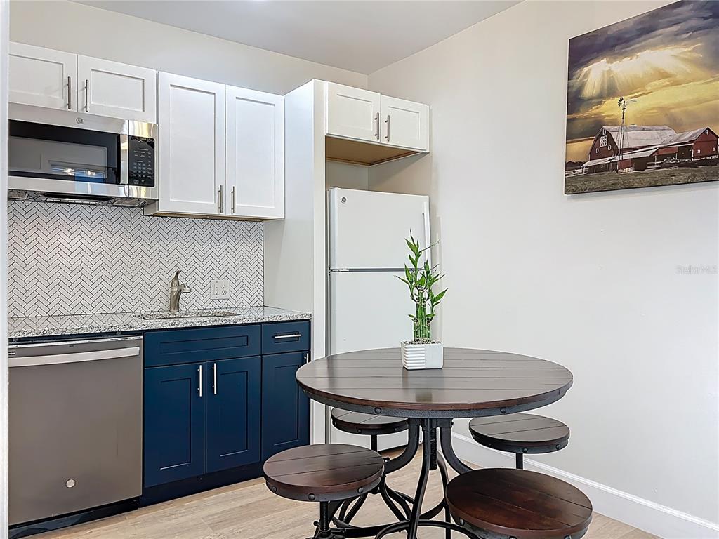 507 East Street Longwood, FL 32750 - Photo 13 of 72 a kitchen with a table and chairs in it