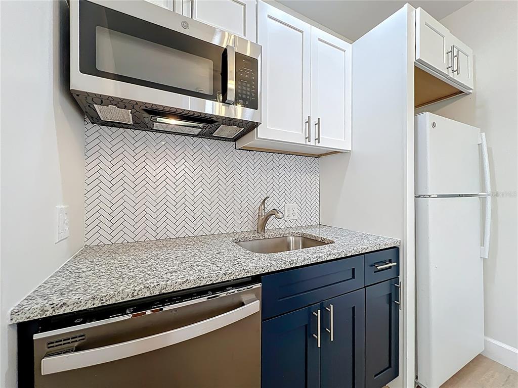 507 East Street Longwood, FL 32750 - Photo 14 of 72 a kitchen with a sink and a microwave
