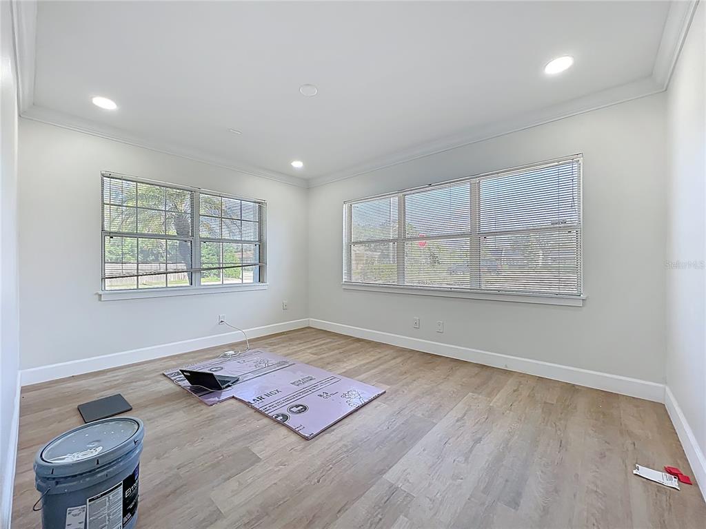 507 East Street Longwood, FL 32750 - Photo 16 of 72 an empty room with windows and wooden floor