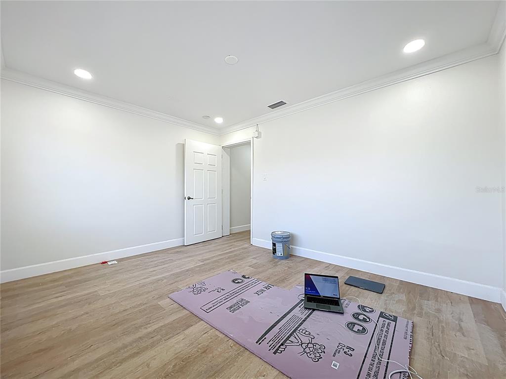 507 East Street Longwood, FL 32750 - Photo 17 of 72 a view of an empty room and a wooden floor