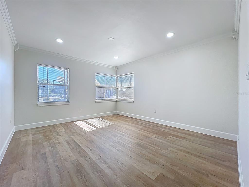507 East Street Longwood, FL 32750 - Photo 19 of 72 a view of empty room with wooden floor and fan