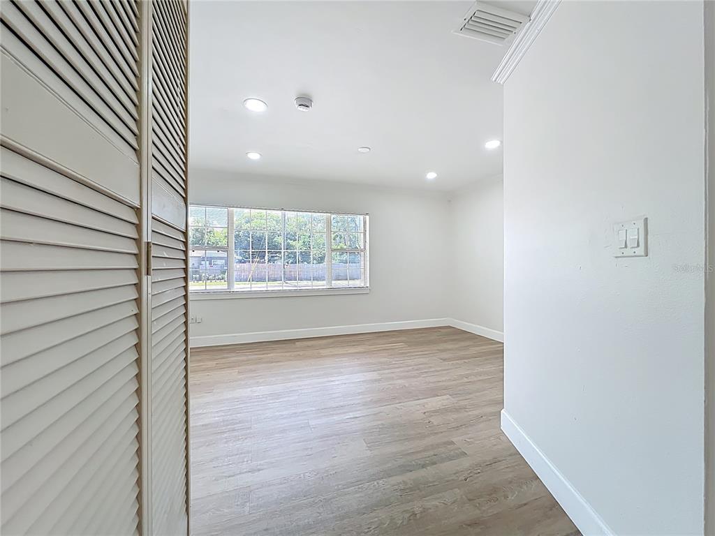 507 East Street Longwood, FL 32750 - Photo 26 of 72 a view of an empty room with wooden floor and a window