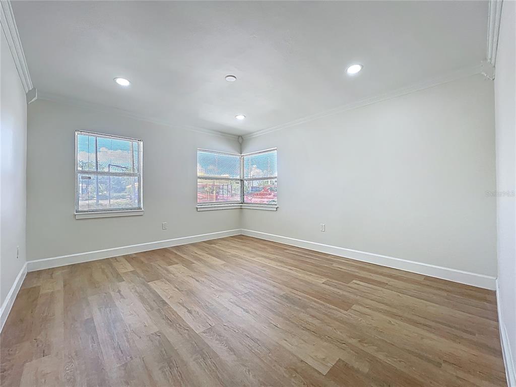 507 East Street Longwood, FL 32750 - Photo 31 of 72 a view of empty room with wooden floor and fan