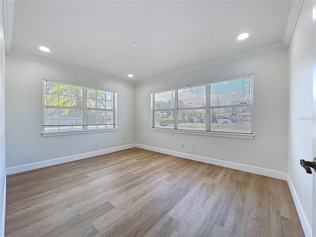 507 East Street Longwood, FL 32750 - Photo 33 of 72 an empty room with wooden floor and windows