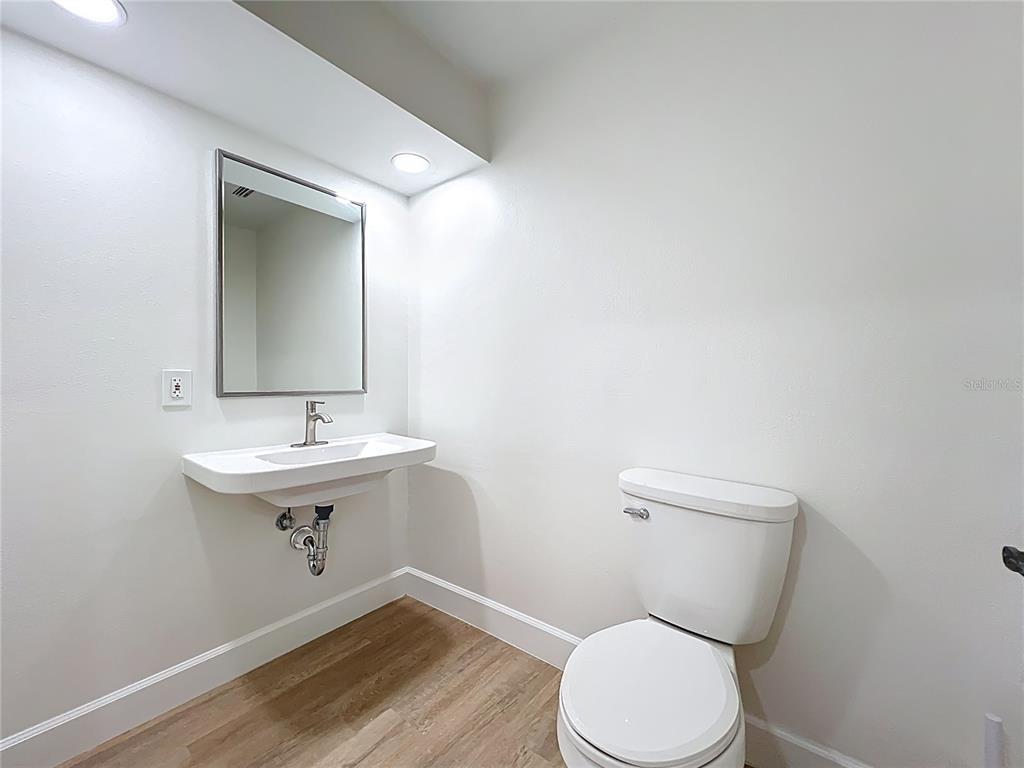 507 East Street Longwood, FL 32750 - Photo 35 of 72 a bathroom with a sink a toilet and mirror