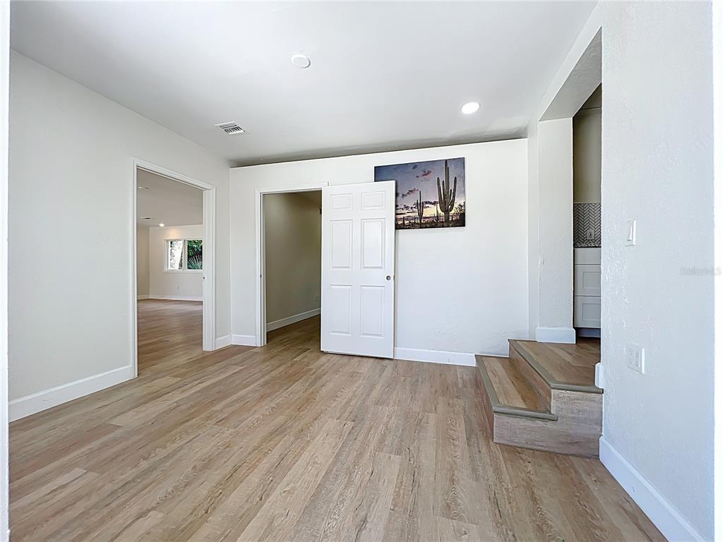 507 East Street Longwood, FL 32750 - Photo 42 of 72 an empty room with wooden floor and windows