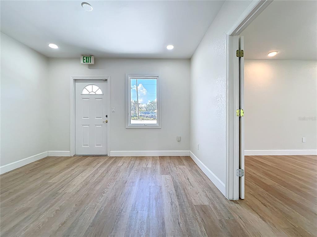 507 East Street Longwood, FL 32750 - Photo 44 of 72 an empty room with wooden floor and windows