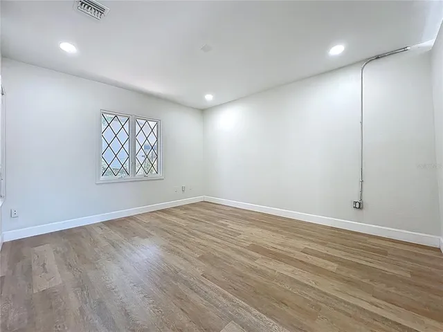 an aerial view of residential house with pool and yard