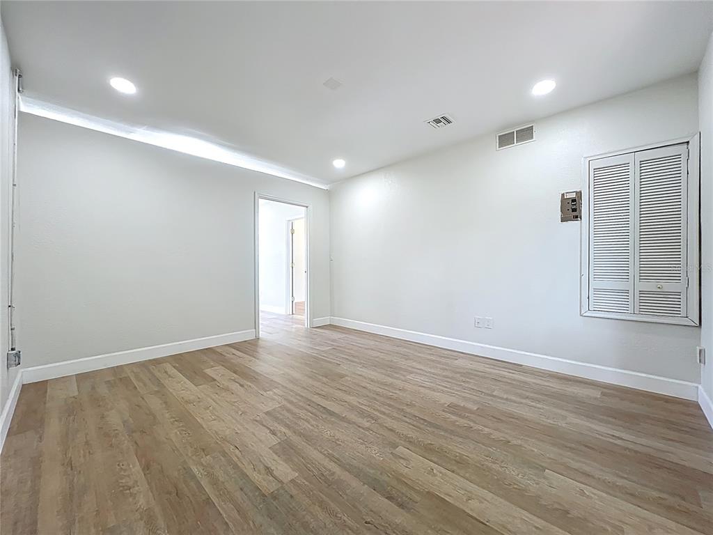 507 East Street Longwood, FL 32750 - Photo 46 of 72 a view of an empty room with wooden floor and a window