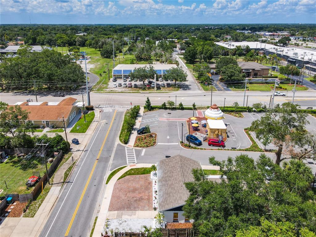 507 East Street Longwood, FL 32750 - Photo 58 of 72 an aerial view of a house with a garden and lake view