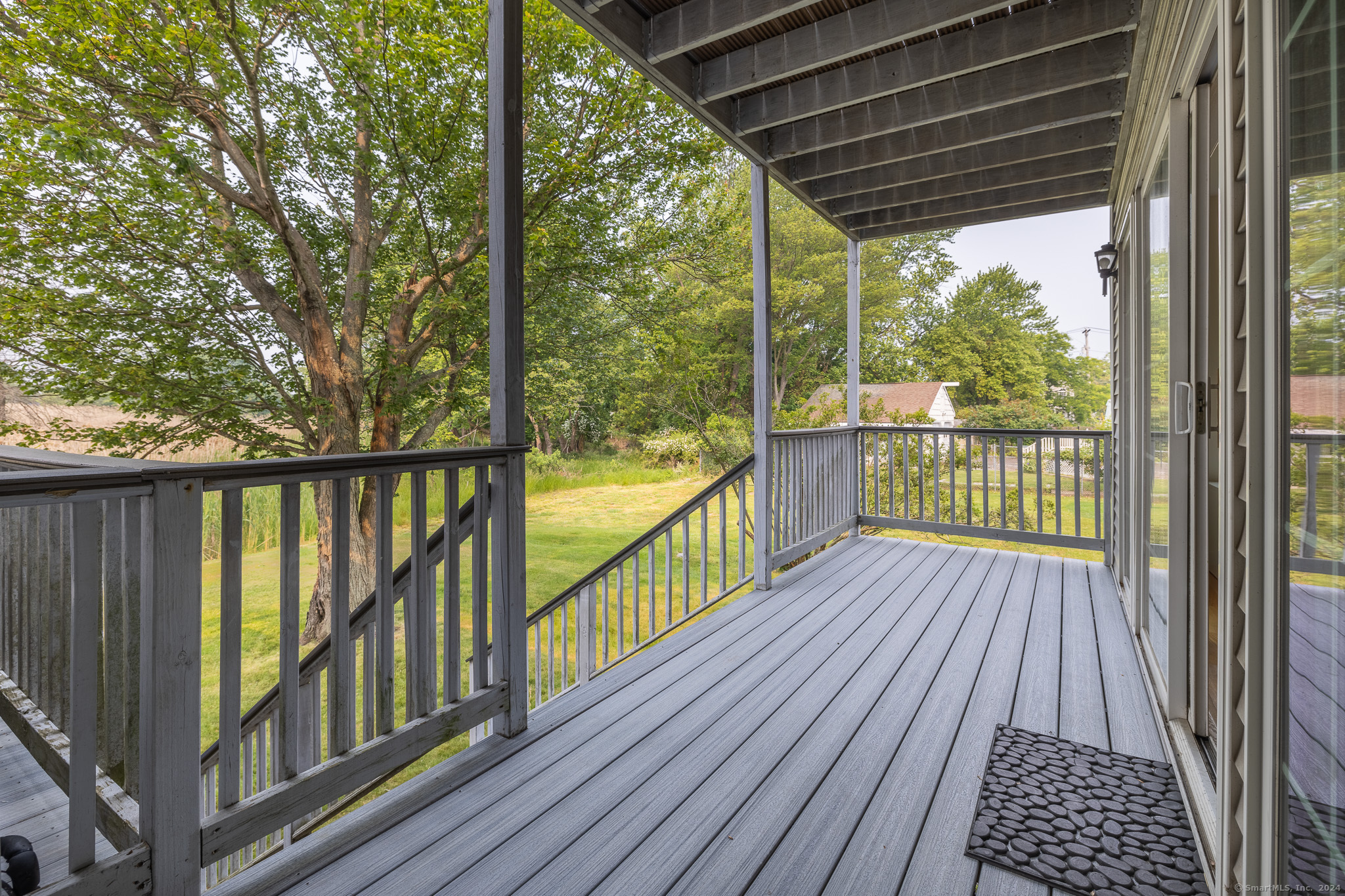 916 Reef Road Fairfield, CT 06824 - Photo 2 of 16 a view of balcony with wooden floor