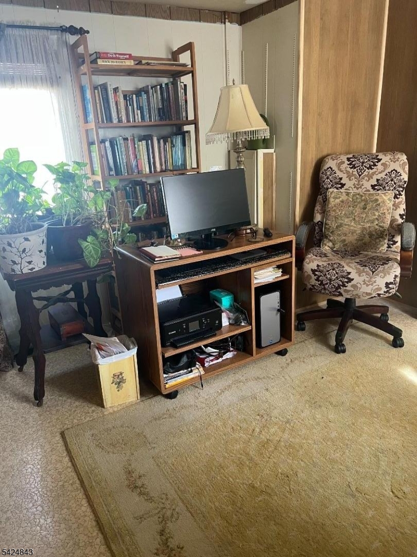 55 Back Street Oxford, NJ 07863 - Photo 12 of 16 a workspace with furniture and a book shelf