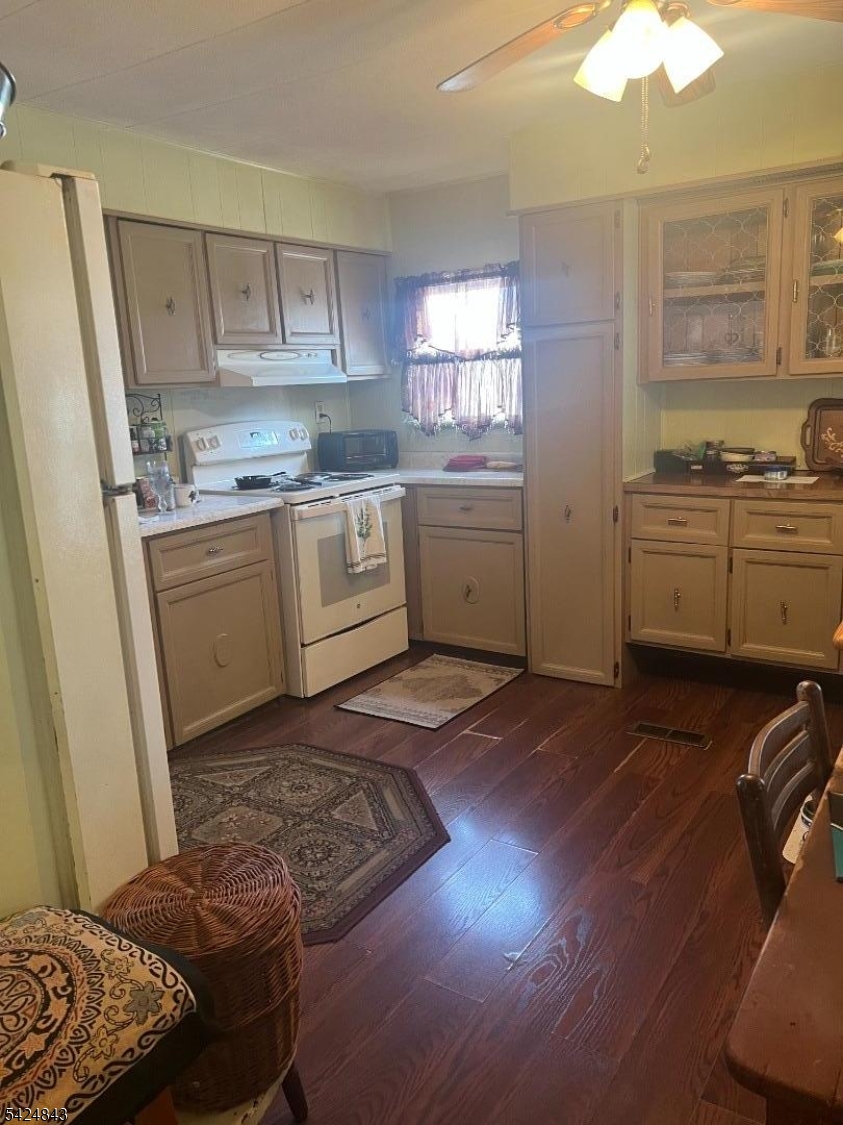 55 Back Street Oxford, NJ 07863 - Photo 7 of 16 a kitchen with a sink a stove cabinets and a window