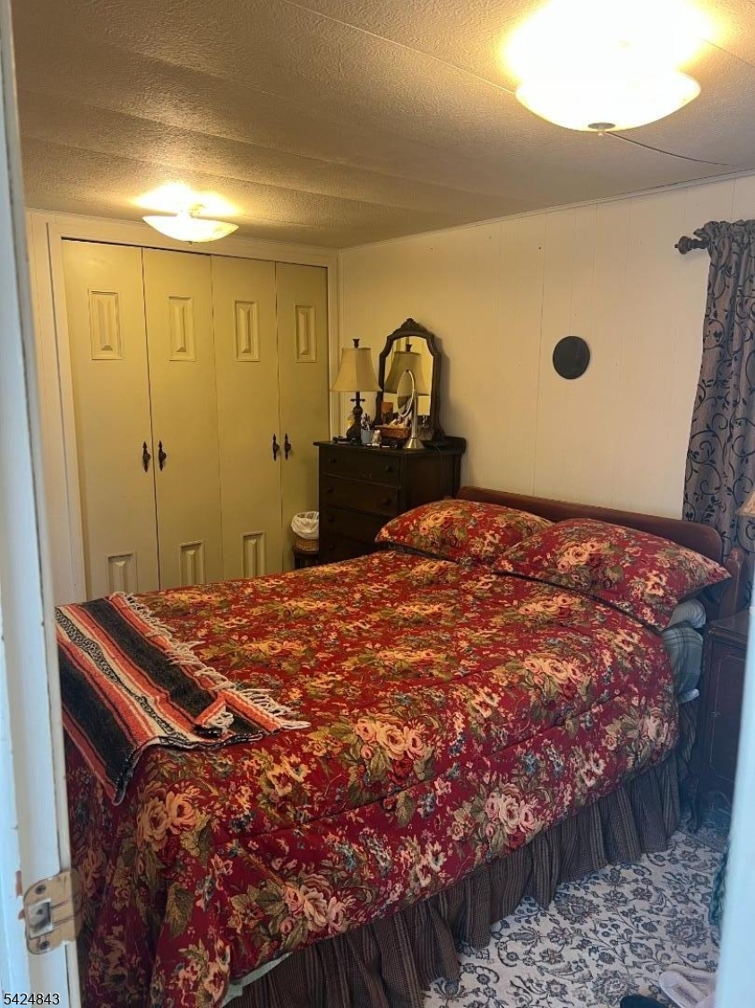 55 Back Street Oxford, NJ 07863 - Photo 8 of 16 a bedroom with a bed and a dresser