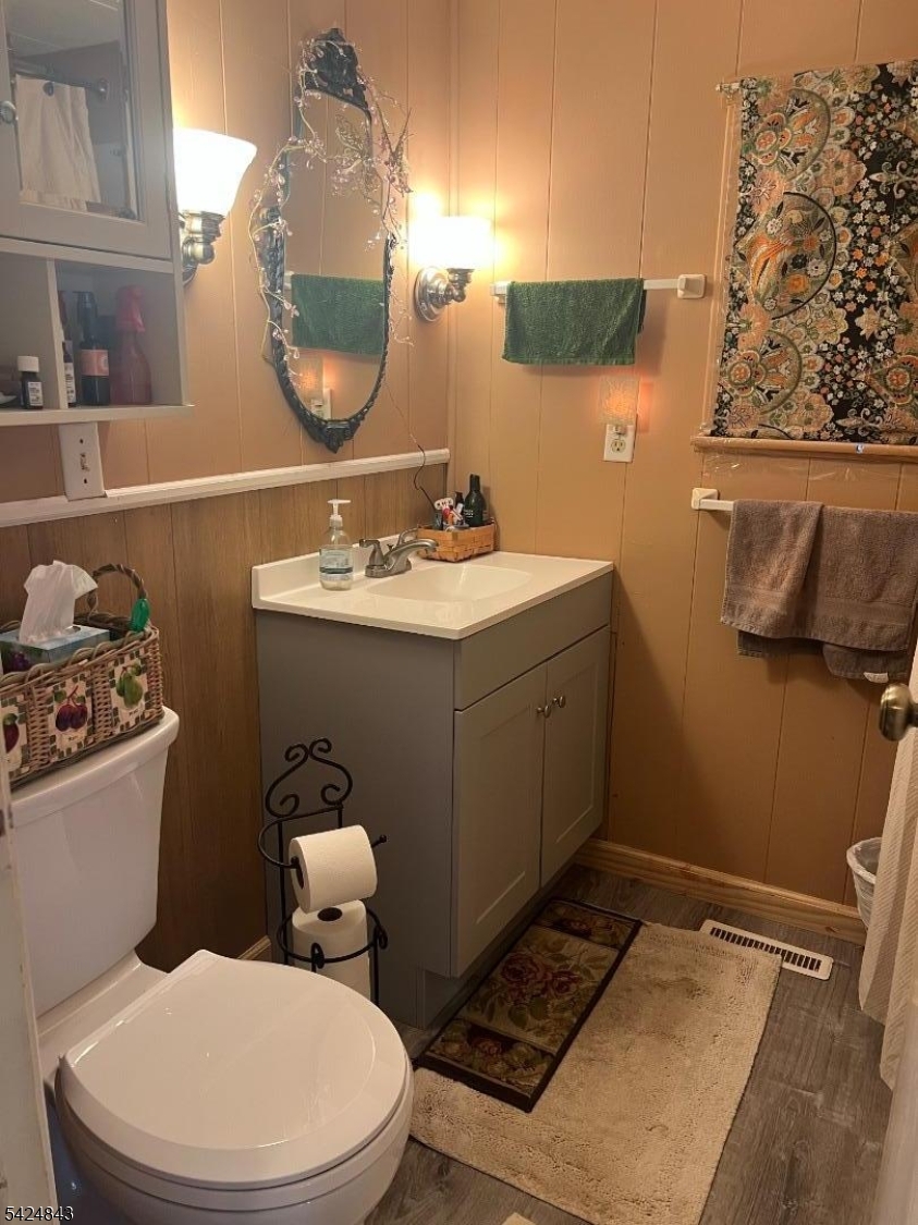 55 Back Street Oxford, NJ 07863 - Photo 10 of 16 a bathroom with a sink mirror and toilet