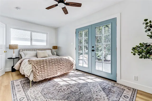 a bedroom with a large bed and a window