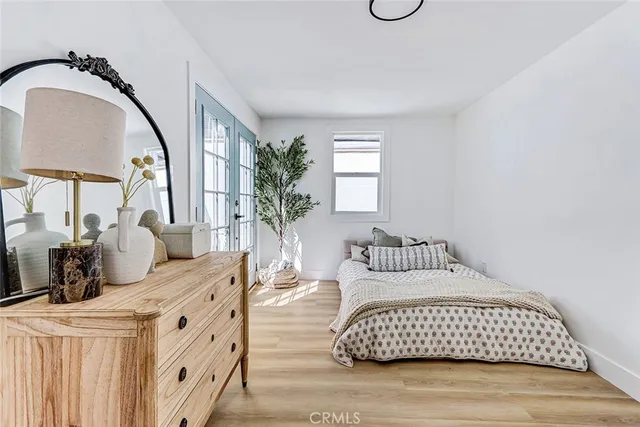a bedroom with a large bed and a window
