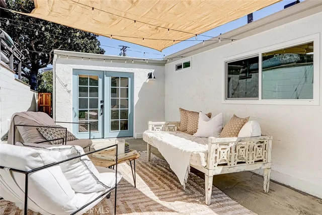 a view of a patio with a table and chairs
