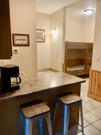 a kitchen with a table and chairs in it
