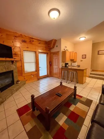 a room with pool table and flat screen tv