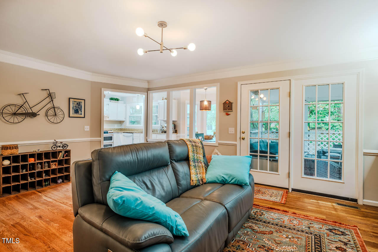 8 Wexford Drive Durham, NC 27713 - Photo 15 of 38 a living room with furniture and a wooden floor