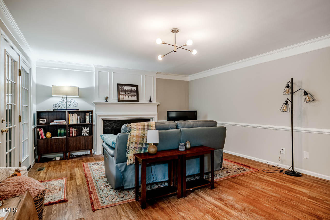 8 Wexford Drive Durham, NC 27713 - Photo 16 of 38 a living room with furniture and a fireplace