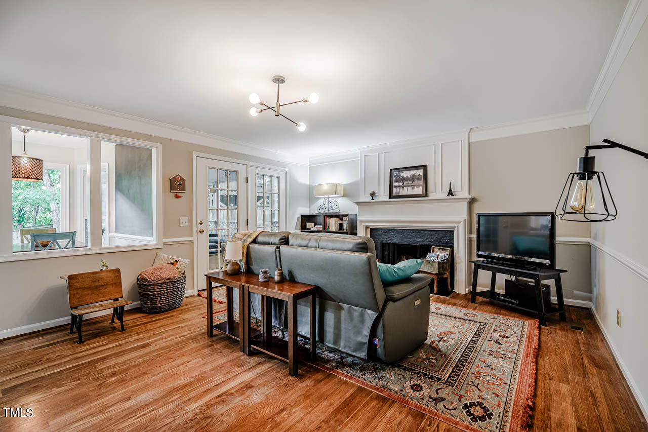 8 Wexford Drive Durham, NC 27713 - Photo 17 of 38 a living room with furniture and a fireplace