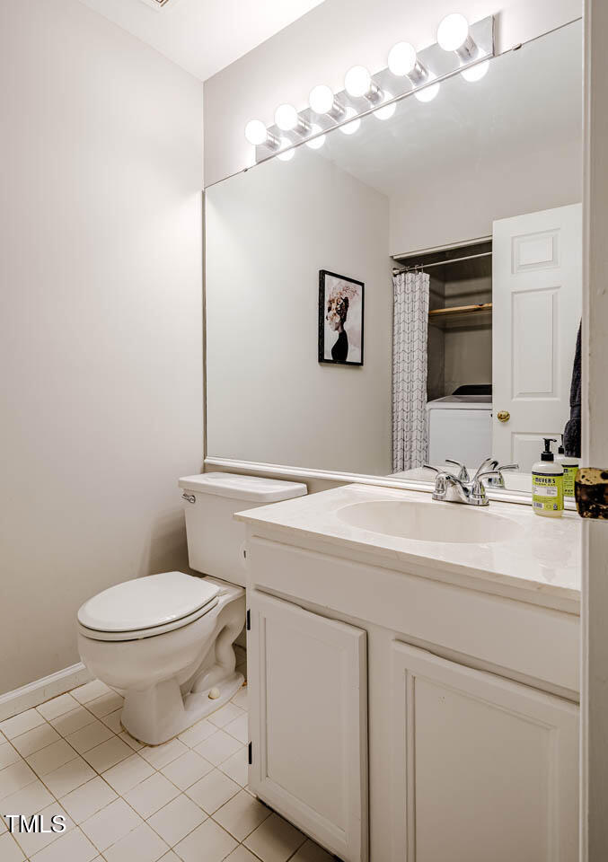 8 Wexford Drive Durham, NC 27713 - Photo 19 of 38 a bathroom with a sink toilet and mirror