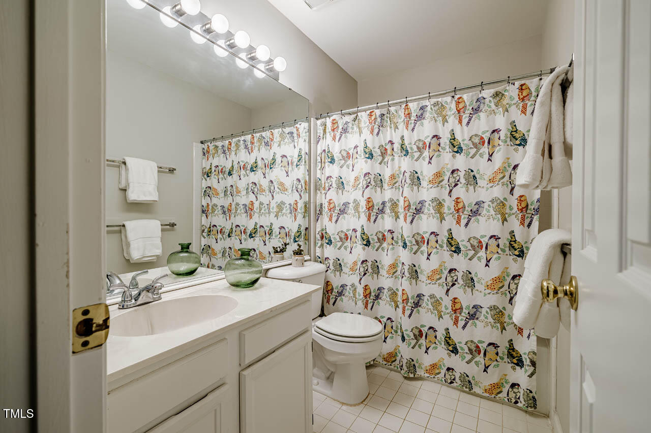 8 Wexford Drive Durham, NC 27713 - Photo 27 of 38 a bathroom with a sink toilet and shower
