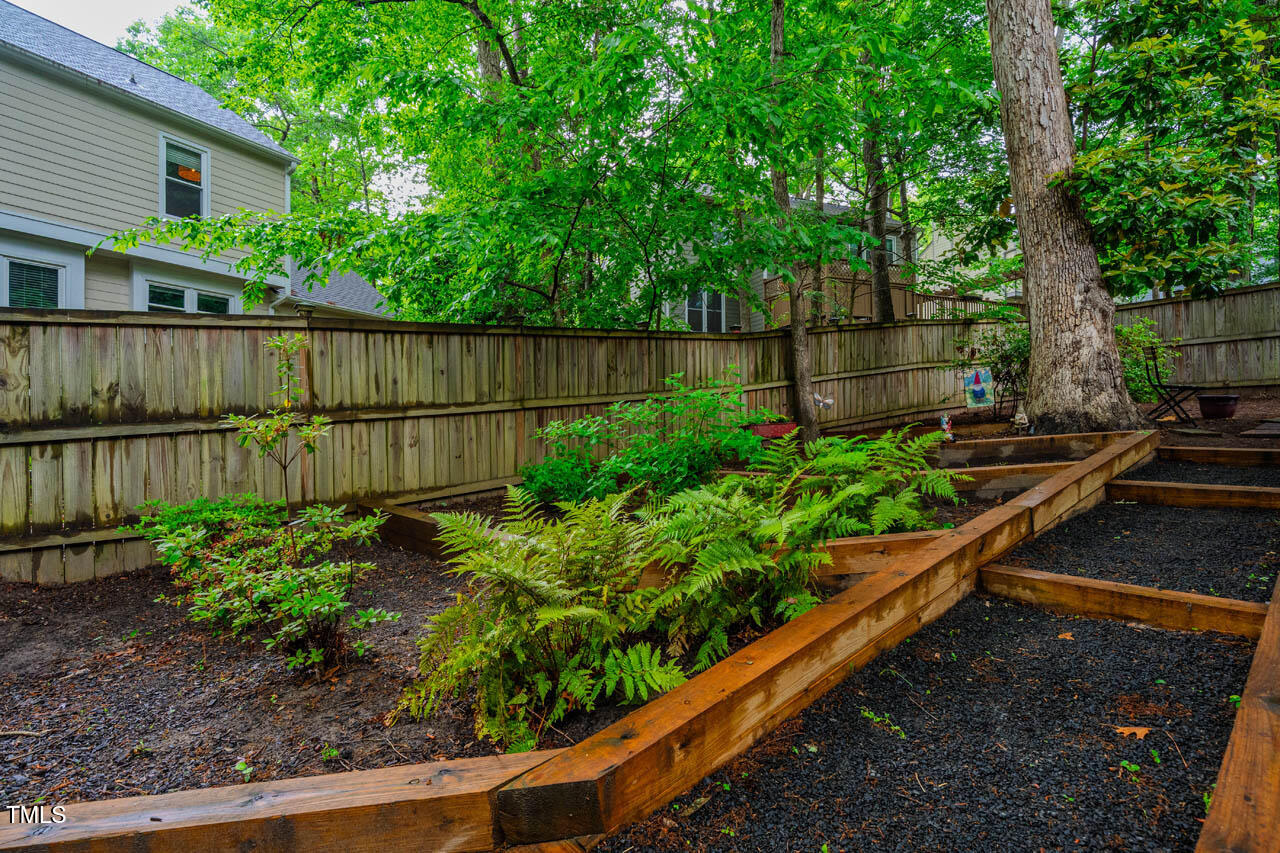 8 Wexford Drive Durham, NC 27713 - Photo 31 of 38 a view of a garden with wooden fence