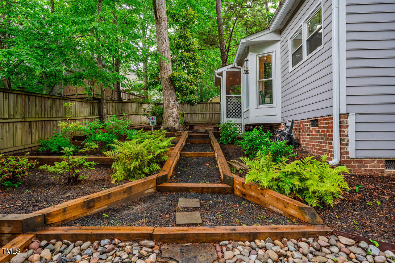 8 Wexford Drive Durham, NC 27713 - Photo 32 of 38 a view of a pathway along the side of a house