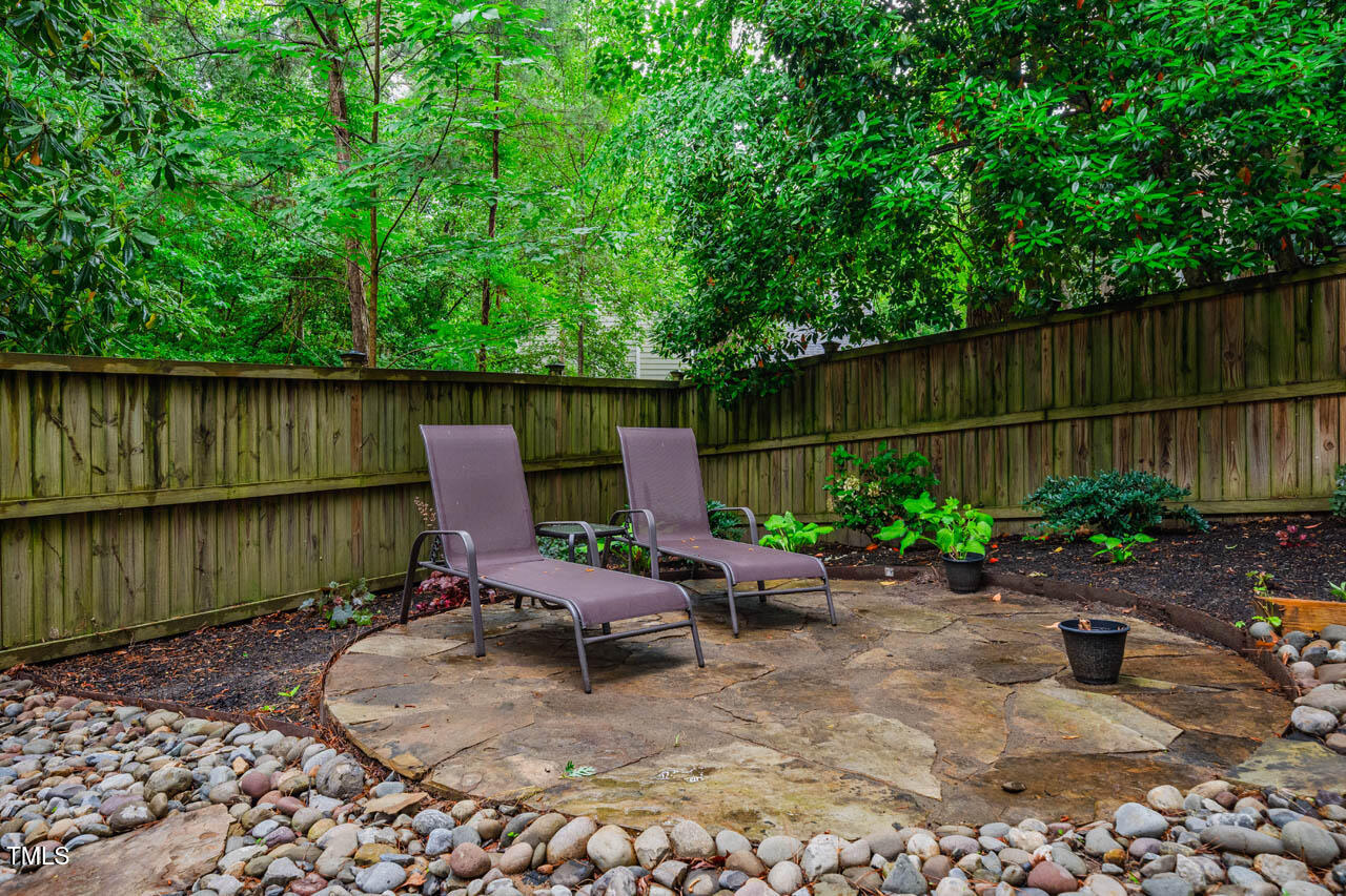 8 Wexford Drive Durham, NC 27713 - Photo 33 of 38 a view of a backyard with plants and outdoor seating