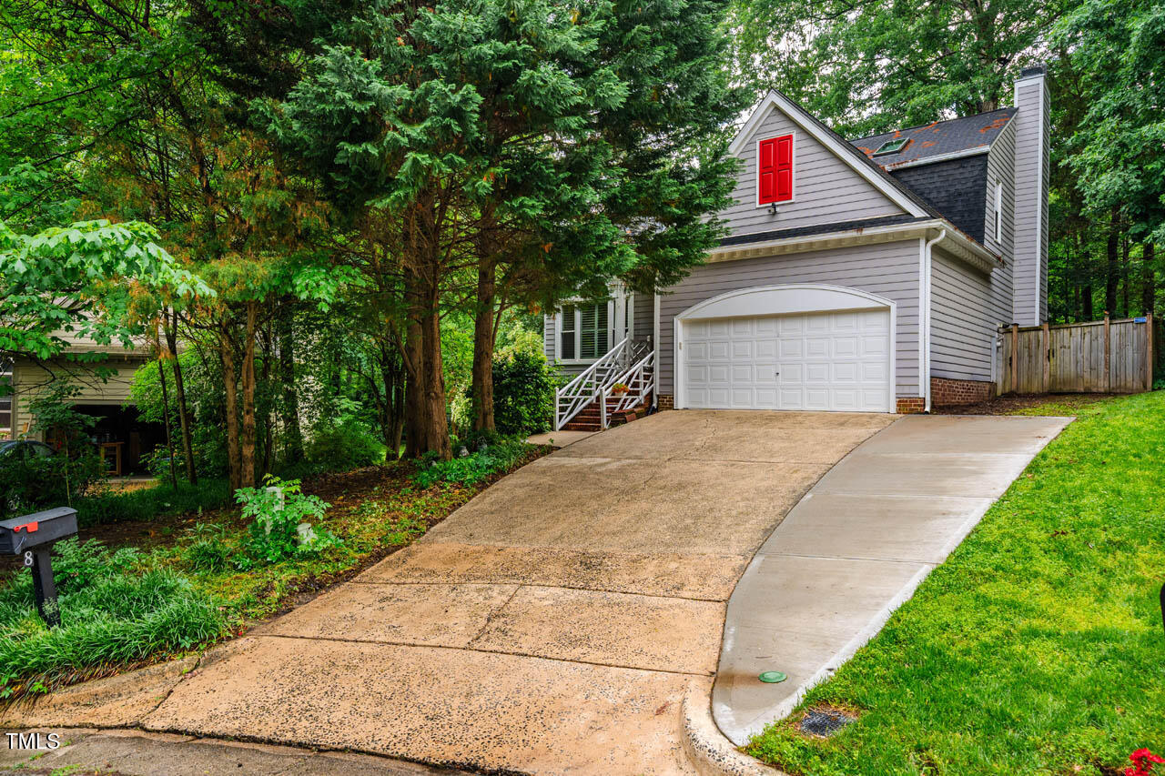 8 Wexford Drive Durham, NC 27713 - Photo 36 of 38 a view of garage with red and white house