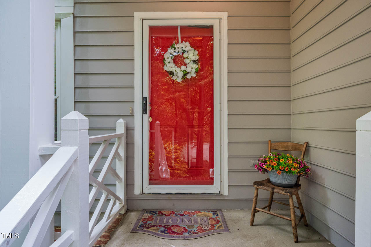 8 Wexford Drive Durham, NC 27713 - Photo 3 of 38 a balcony with a rug and a chair