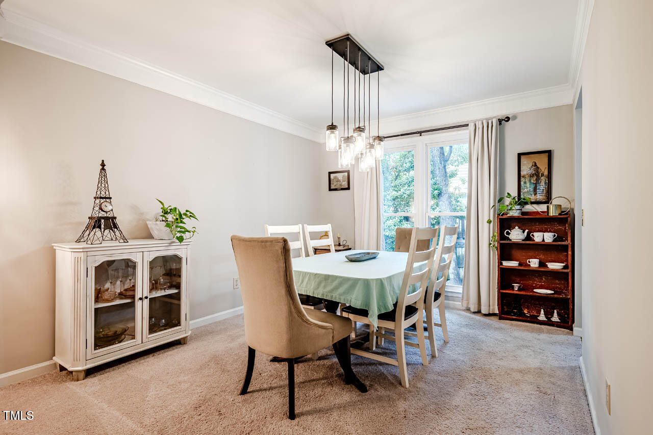 8 Wexford Drive Durham, NC 27713 - Photo 6 of 38 a view of a dining room with furniture window and outside view