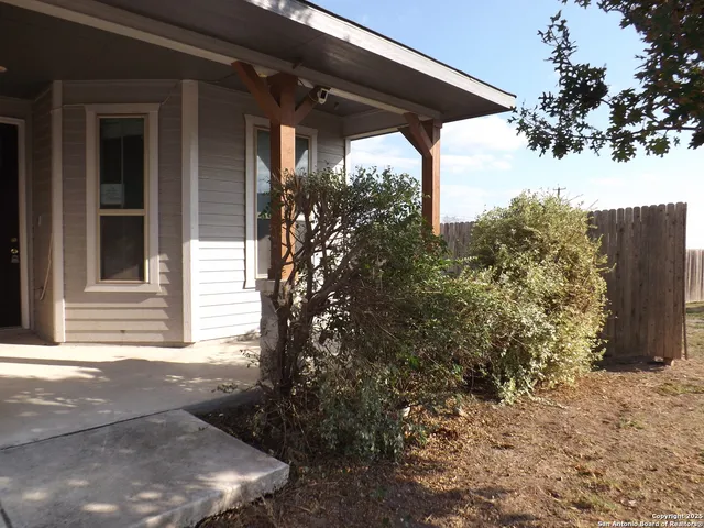 a view of a house with a tree