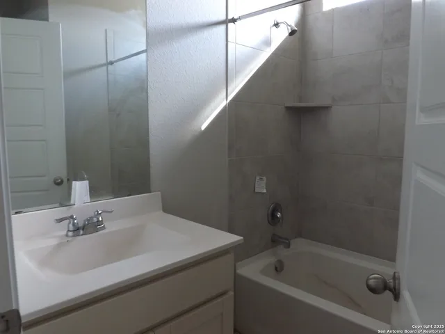 a bathroom with a sink and a bathtub