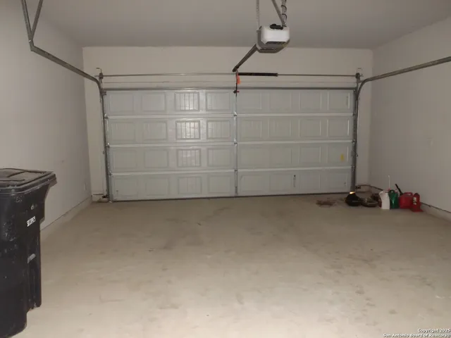 a view of storage and utility room with projector and cabinets