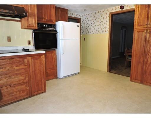 1780 Wilbraham Road Springfield, MA 01119 - Photo 4 of 19 a view of a kitchen with refrigerator and cabinet