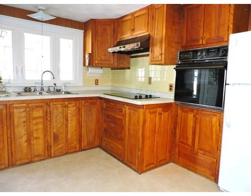 1780 Wilbraham Road Springfield, MA 01119 - Photo 5 of 19 a kitchen with granite countertop stainless steel appliances a sink dishwasher and cabinets with wooden floor