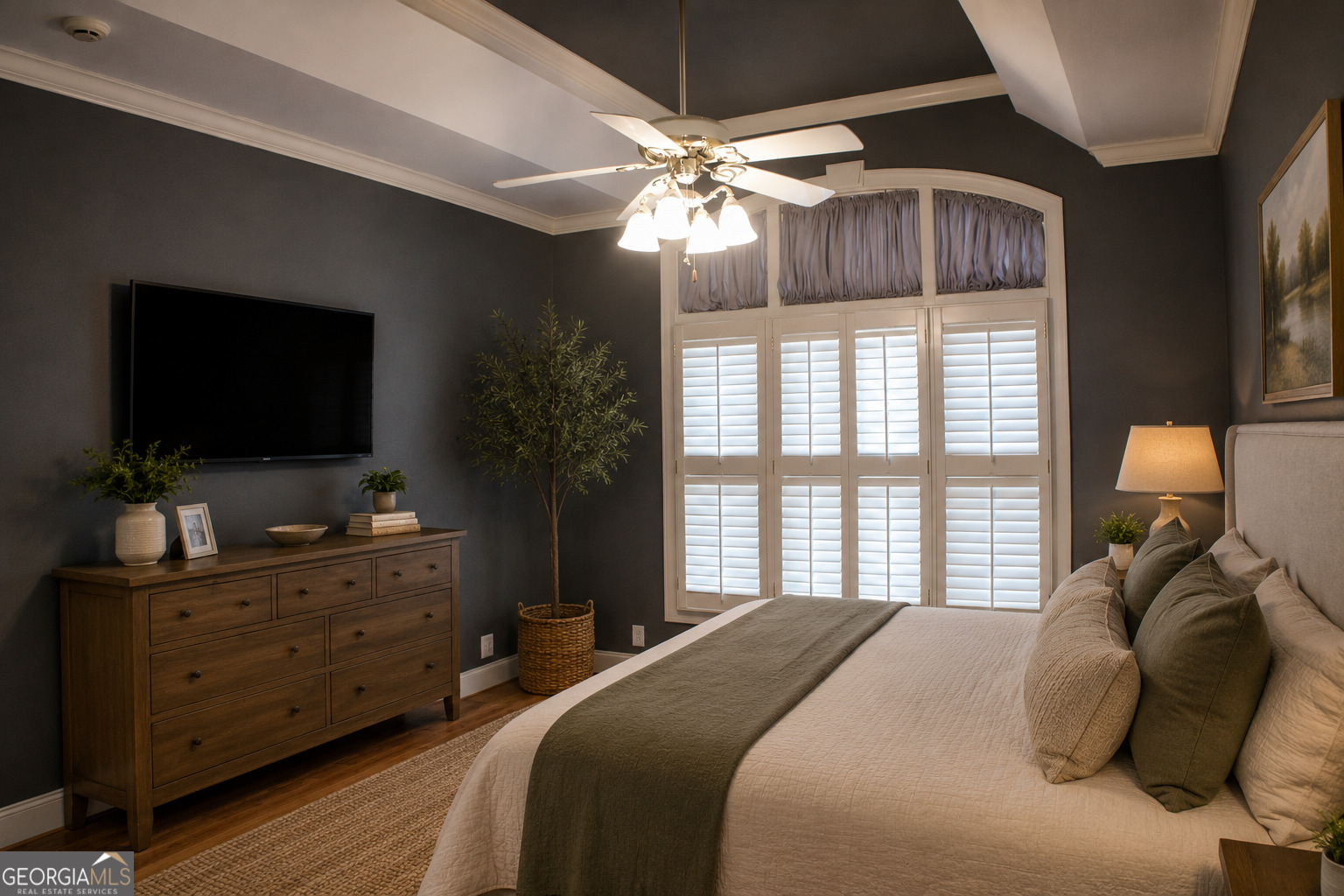 418 Flora Ext Avenue Rome, GA 30161 - Photo 17 of 35 a bedroom with a bed and a flat tv screen on dresser
