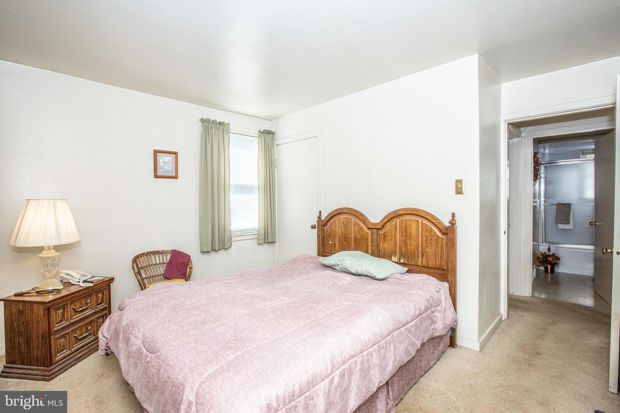3328 Stoudts Ferry Bridge Road Reading, PA 19605 - Photo 11 of 29 a bedroom with a bed and a lamp