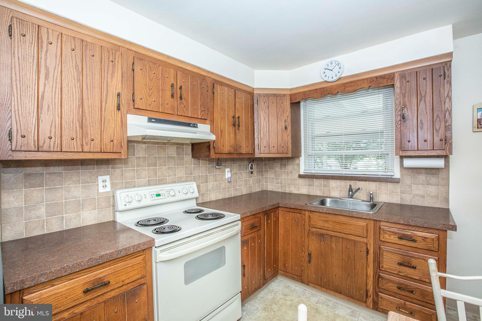 3328 Stoudts Ferry Bridge Road Reading, PA 19605 - Photo 12 of 29 a kitchen with stainless steel appliances granite countertop a sink stove and cabinets