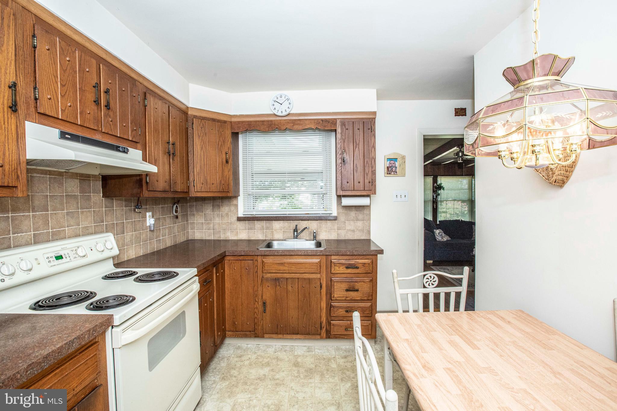 3328 Stoudts Ferry Bridge Road Reading, PA 19605 - Photo 13 of 29 a kitchen with a sink a stove and cabinets